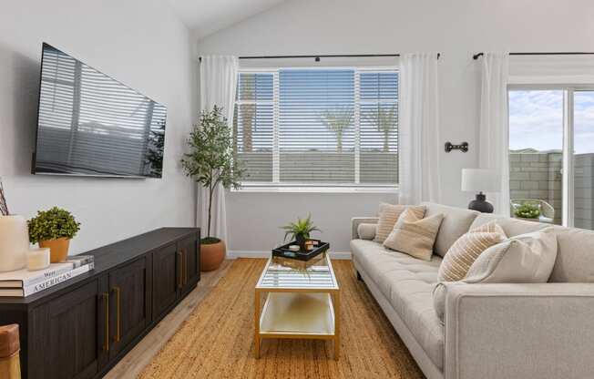 a living room with a couch and a coffee table