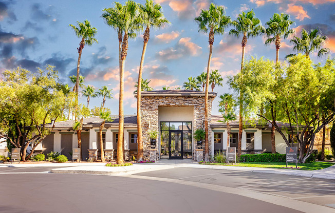 a building with palm trees in front of it