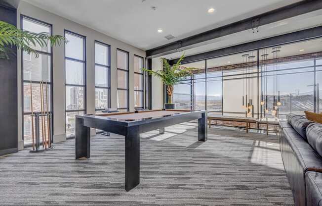 a games room with a pool table