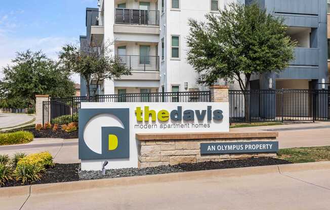 The Davis sign is in front of a building.