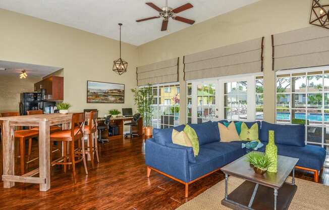 a living room and dining room with a couch and a table