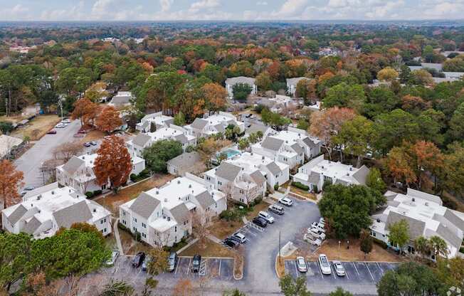 A bird's eye view of a residential area with houses and trees.