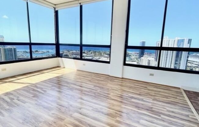 Rarely available corner end 2 bed 2 bath unit with 2 assigned parking stalls on high floor