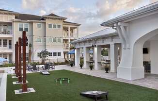 a view of the courtyard at the enclave at woodbridge apartments in sugar land, tx
