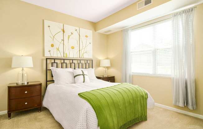 bedroom view with bed and window kitchen view at Skye at Arbor Lakes