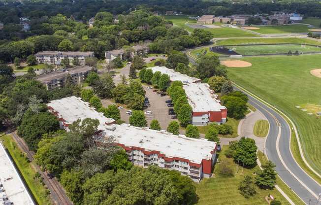 an aerial view of a campus with buildings and a golf course