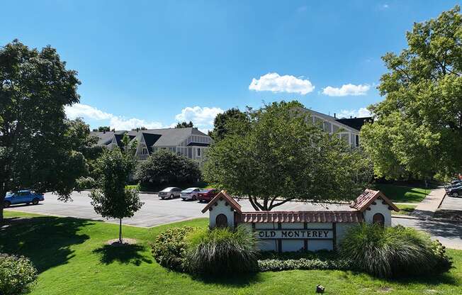 A sign that says Old Monterey in front of a building at Old Monterey Apartments, Springfield, MO