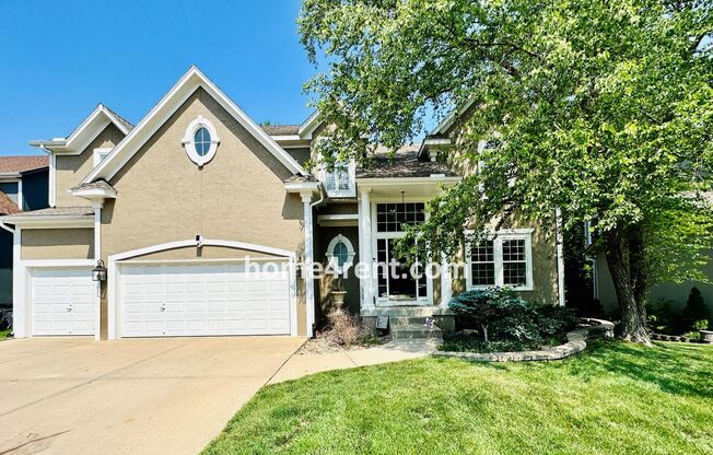 Beautiful Four Bedroom Home in a Quiet Neighborhood w/ an Updated Kitchen, Wood Floors, and a Finished Basement!