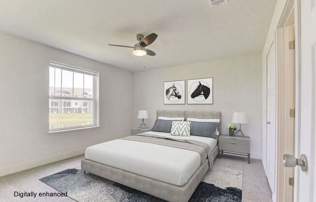 a bedroom with a bed and a ceiling fan