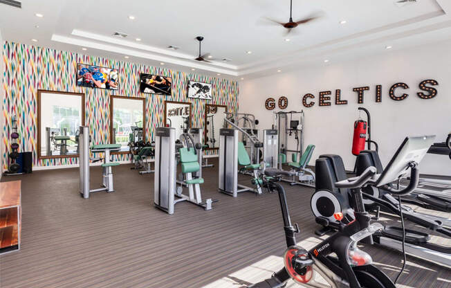 a gym with treadmills and other exercise equipment at Residences at Stevens Pond, Saugus