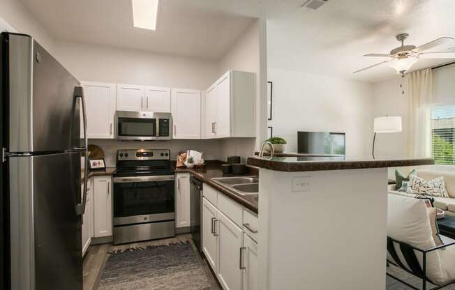 the preserve at ballantyne commons apartment kitchen with stainless steel appliances