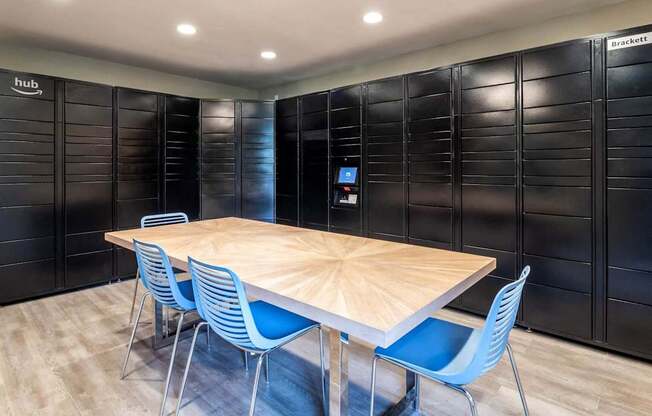 A conference room with a wooden table and blue chairs.