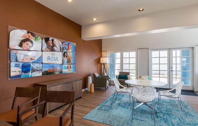 A living room with a large Azul poster on the wall.