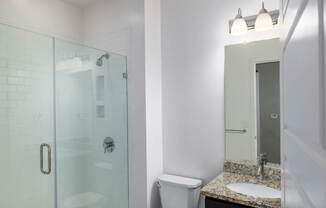 Bathroom with frameless shower at Leo  at Waterfront Station in the Southwest Waterfront neighborhood in SW, Washington, DC 20024
