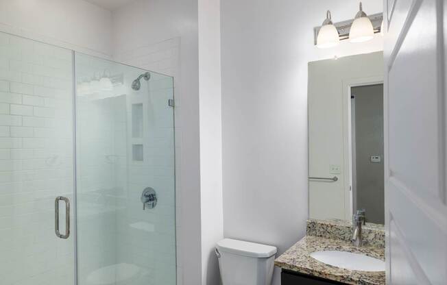 Bathroom with frameless shower at Leo  at Waterfront Station in the Southwest Waterfront neighborhood in SW, Washington, DC 20024