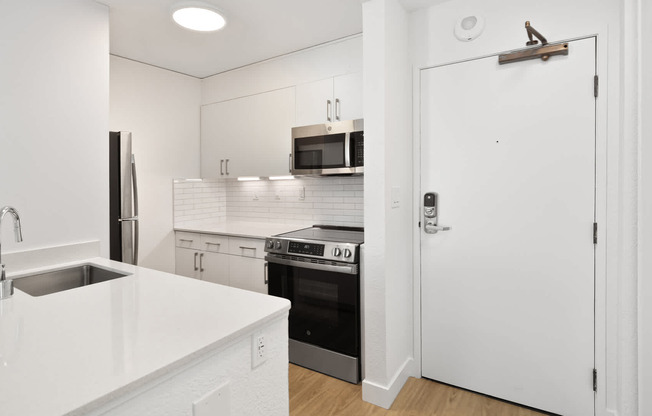 Kitchen with Stainless Steel Appliances and Hard Surface Flooring