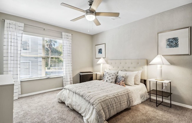 a bedroom with a bed and a ceiling fan at Reserve at Temple Terrace, Temple Terrace