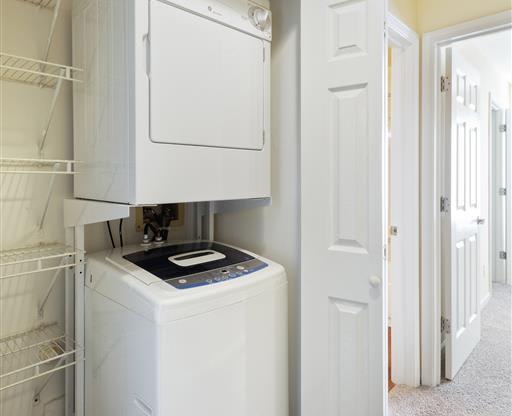 a white washer and dryer in a room