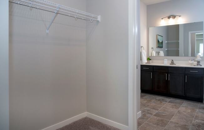 Large walk in closet and double vanity bathroom at The Sixton apartments in Shakopee, MN