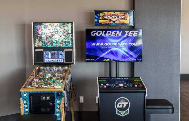two video games and a large screen tv in a room