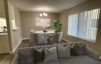 a living room with a couch and chairs and a table