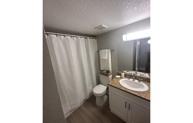 a room with a sink and a mirror