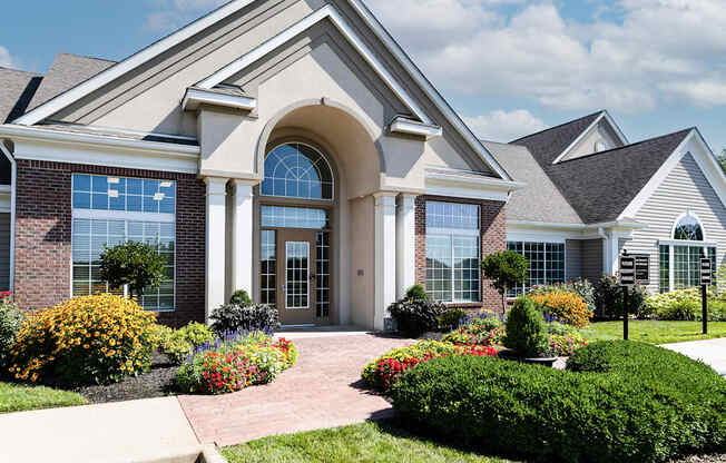 an image of a church with flowers in front of it