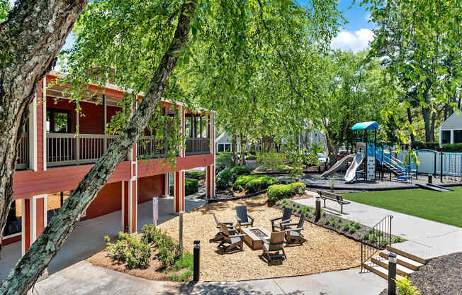 A playground area with a slide and a swing set.