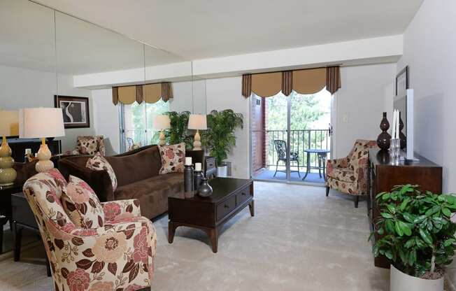 Living room with private balcony at Rockdale Gardens Apartments*, Baltimore, 21244