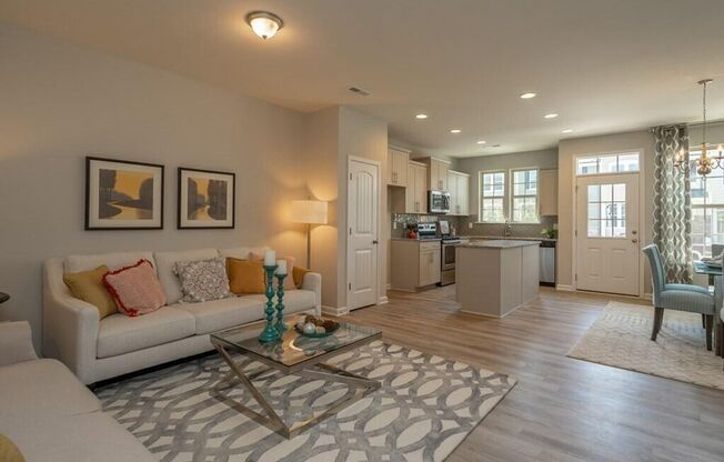 Gorgeous new townhome in the heart of Clayton. Includes Washer, Dryer, Refrigerator and Blinds. Community Pool Access