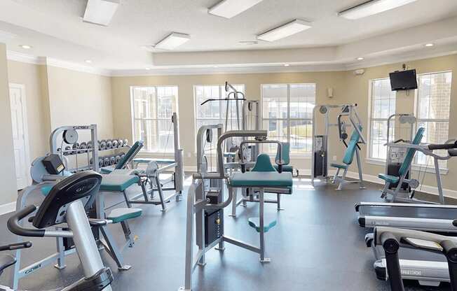 fitness room with weights and other exercise equipment