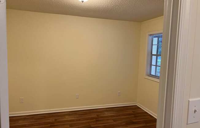 Bedroom with wood plank flooring