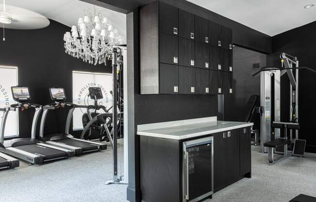 a fitness room with a treadmill and other exercise equipment