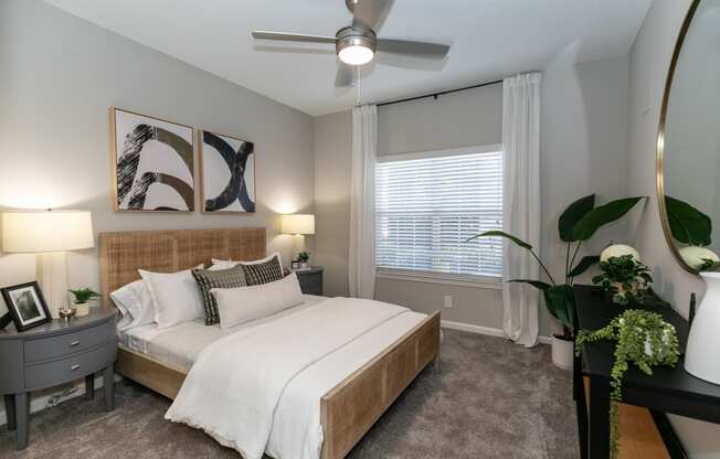 a bedroom with a large bed and a ceiling fan at Willowest in Lindbergh, Georgia