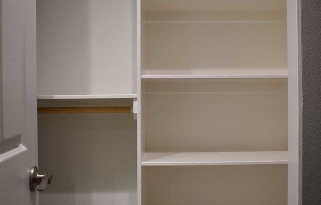 bedroom closet with shelving unit