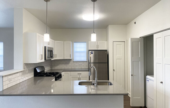 an end style kitchen with a window