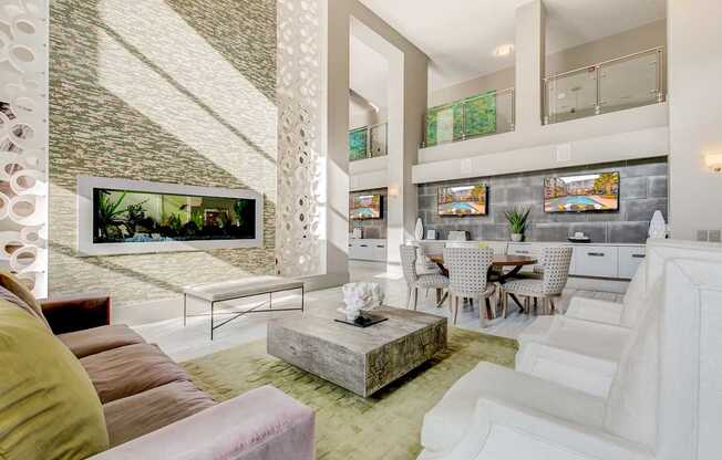 A living room with a white couch and a television.