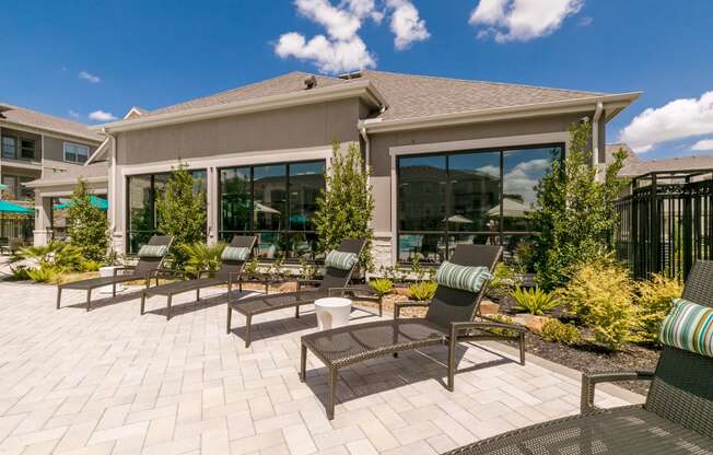 Poolside Sundeck With Relaxing Chairs at Cue Luxury Apartments, Cypress, 77433