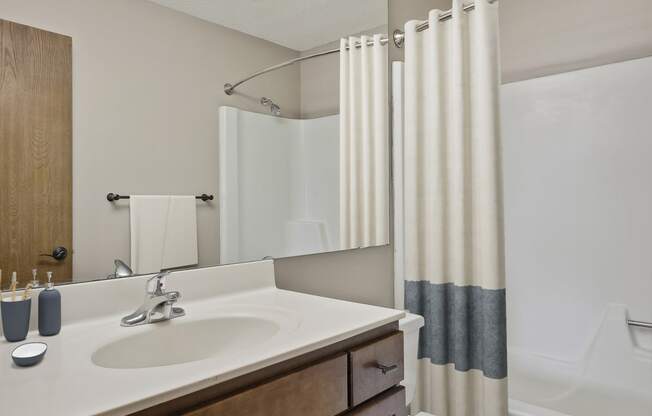 a bathroom with a sink toilet and bathtub