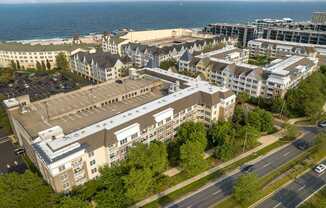 an aerial view of a city with buildings and the ocean at Pier Village Apartments, New Jersey