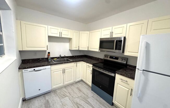 Updated 3-Bed/2-baths Home with Screened Porch & Lush Yard in Pompano Beach Highlands