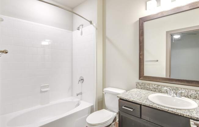 a bathroom with a sink toilet and a bath tub