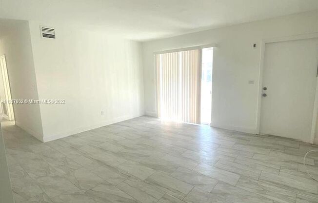 Updated 3-Bed/2-baths Home with Screened Porch & Lush Yard in Pompano Beach Highlands