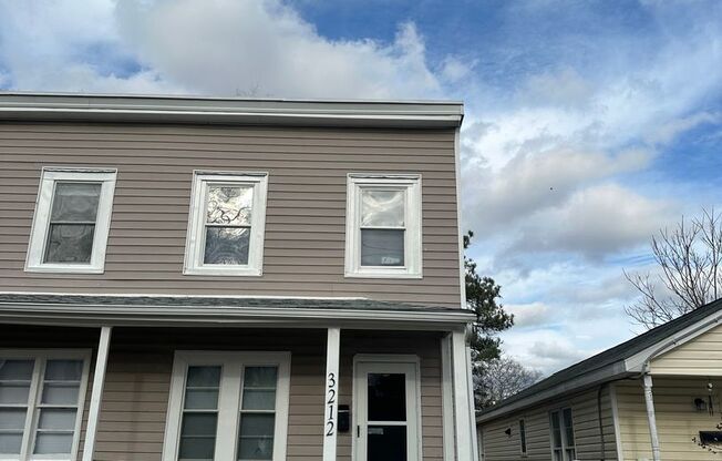 2 bed 2 level row house in Church Hill! All electric central hvac, parking, porch, yard back deck, and laundry!