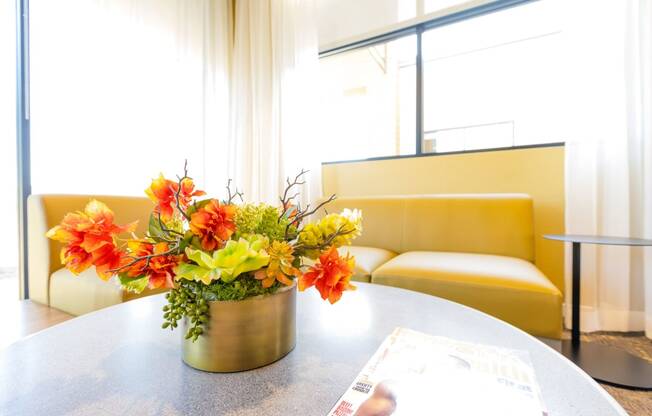 a vase of flowers on a table in a room