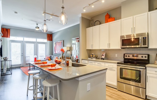 a kitchen with a counter top and a table with chairs