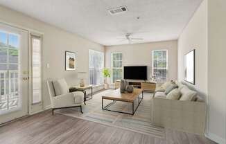 A living room with a couch, chair, and television.