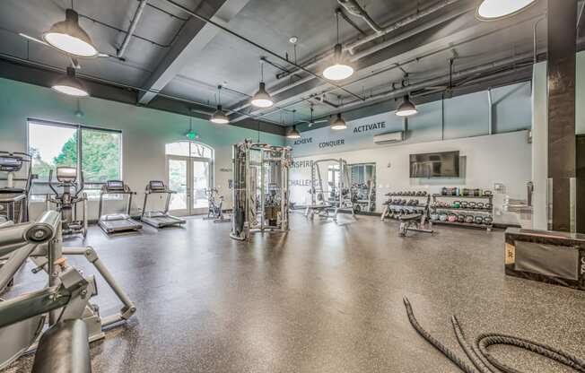 Spacious fitness center with cardio machines and other exercise equipment at Platform 14, Hillsboro, OR