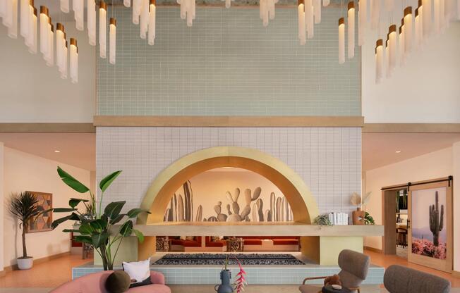 A statement lobby with desert tones, layered lighting, and inviting seating—welcome home to Modera Rio Salado.