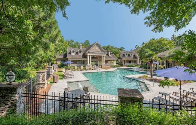 A large house with a pool in the backyard.
